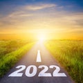 New Year 2022 Goals Concept : Empty asphalt road sunrise with text go to New year 2022 Royalty Free Stock Photo