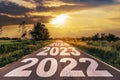 New Year 2022 Goals Concept : Empty asphalt road sunrise with text go to New year 2022 Royalty Free Stock Photo