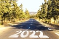 New Year Goals Concept : Empty asphalt road sunset and Happy New Year 2022 in Algeria Royalty Free Stock Photo