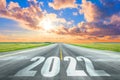 New Year 2022 Goals Concept. Empty asphalt road sunset with text 2022 Royalty Free Stock Photo