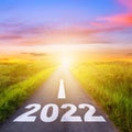 New Year 2022 Goals Concept : Empty asphalt road sunset with text go to New year 2022 Royalty Free Stock Photo