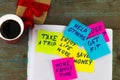 new year goals or resolutions - colorful sticky notes on a Notepad with coffee Cup Royalty Free Stock Photo