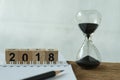 New year 2018 goals, target or checklist concept as sandglass an Royalty Free Stock Photo