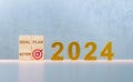 2024 new year. gold 2024 year number and Target, goal, plan, action on wooden cubes. Beginning 2024