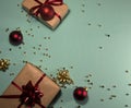 New year holiday background with gift boxes, red balls, gold sequins