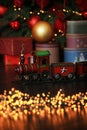 New year, Holiday celebration concept. Red retro toy metal vintage soviet train with stars under Christmas tree on dark background Royalty Free Stock Photo