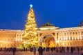 New Year Holidays in Russia. Christmas tree in winter Petersburg Palace Square, people around