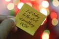 Let today be the start of something new. New year inspirational motivational quote on a paper note in hand -