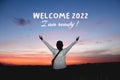 New year inspirational motivational quote - Welcome 2022. I am ready. With a woman standing alone, hand raised with open arms Royalty Free Stock Photo