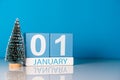 New year. January 1st. Day 1 of december month, calendar with little christmas tree on blue background. Winter time Royalty Free Stock Photo