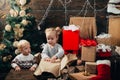 New year kids. kiddy. Child with a Christmas present on wooden background. Winter kids. Opening gifts on Christmas and Royalty Free Stock Photo