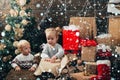 New year kids. kiddy. Child with a Christmas present on wooden background. Winter kids. Opening gifts on Christmas and