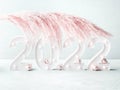 New year 2022 lights numbers with pink pampas branch, ornaments