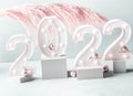 New year 2022 lights numbers with pink pampas branch, podiums
