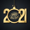 2021 New Year luxury greeting card with handwritten holiday greetings Happy New Year and golden colored christmas ball. Royalty Free Stock Photo