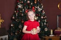 New Year 2020. Merry Christmas, happy holidays. Close-up portrait of a little girl with a candle. Little girl holds a candle in he Royalty Free Stock Photo