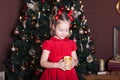 New Year 2020. Merry Christmas, happy holidays. Close-up portrait of a little girl with a candle. Little girl holds a candle in he Royalty Free Stock Photo