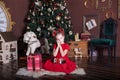 New Year 2020! Merry Christmas, happy holidays! Happy little girl with a gift on the background of the Christmas tree. Christmas i Royalty Free Stock Photo