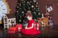 New Year 2020. Merry Christmas, happy holidays. Portrait of little girl with candle. Little girl holds a candle in her hands in fr Royalty Free Stock Photo