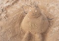 New Year or Merry Christmas sand snowman on ocean beach