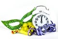 New Year at Midnight. Clock at twelve o'clock with party favors and grapes