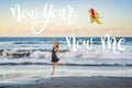 NEW YEAR NEW ME concept A young woman launches a kite on the beach. Dream, aspirations, future plans