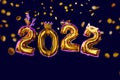 New year number 2022 of golden balloons in masquerade masks