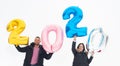 2020. New Year numbers concept. Couple in love holding 2020 numbers. Royalty Free Stock Photo