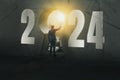 2024 new year numbers on wall, opportunity businessman standing on staircase to looking keyhole door, leader concept vision and