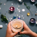 New year party decor hands holding light candle Royalty Free Stock Photo