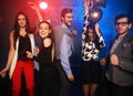 New year party, holidays, celebration, nightlife and people concept - Young people having fun dancing at a party Royalty Free Stock Photo