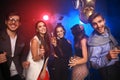 New year party, holidays, celebration, nightlife and people concept - Young people having fun dancing at a party Royalty Free Stock Photo