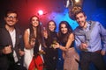 New year party, holidays, celebration, nightlife and people concept - Young people having fun dancing at a party Royalty Free Stock Photo