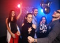 New year party, holidays, celebration, nightlife and people concept - Young people having fun dancing at a party Royalty Free Stock Photo