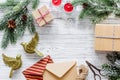 New year party preparation with gifts wrapping in boxes and envelopes on wooden background top veiw space for text Royalty Free Stock Photo