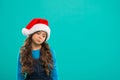 New year party. Santa claus kid. Present for Xmas. Childhood. Happy winter holidays. Small sad girl. Christmas shopping Royalty Free Stock Photo