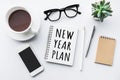 New year plan text on notepad with office accessories. Royalty Free Stock Photo