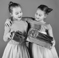 New Year presents concept. Sisters with wrapped gift boxes Royalty Free Stock Photo