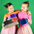 New Year presents concept. Sisters with wrapped gift boxes Royalty Free Stock Photo