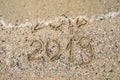 New Year 2019 replace 2018 on the sea beach concept, copy space. Wave starting to cover digits 2018. New Year 2019 is coming Royalty Free Stock Photo