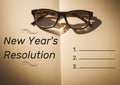 New year resolution goals against books and spectacles Royalty Free Stock Photo