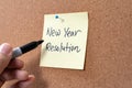 New Year resolution written on yellow sticky note pad Royalty Free Stock Photo