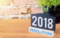 New year 2018 resolutions on blackboard sign and green plant on Royalty Free Stock Photo