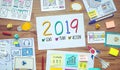 2019 new year resolutions with business digital marketing and paperwork sketch on wood table.analysis strategy concepts