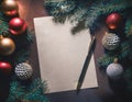 New Year resolutions or Christmas letter to Santa. Blank paper with copy space and festive decorations on table. Goals,