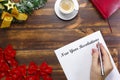 New Year Resolutions list lying on wooden board. Man making goal list Royalty Free Stock Photo