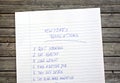 New Year resolutions listed on piece paper Royalty Free Stock Photo