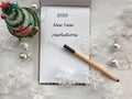 New year resolutions. 2020 new year. New year concept. White notebook sheet with pen on white background covered with christmas de Royalty Free Stock Photo