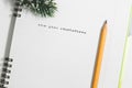 new year resolutions, Notebook and yellow pencil with conifer br Royalty Free Stock Photo