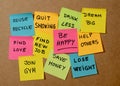 New Year resolutions or popular Goals and colorful sticky post its memo notes on cork board Royalty Free Stock Photo